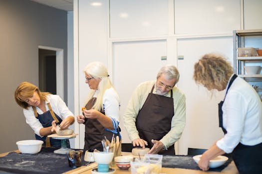 People engaged in a pottery workshop, crafting bowls indoors in Portugal.